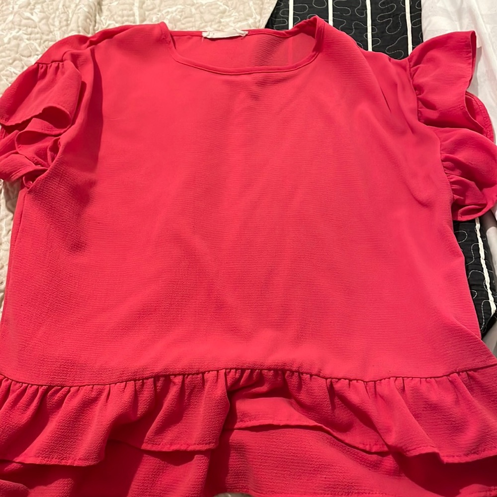 pink ruffled blouse